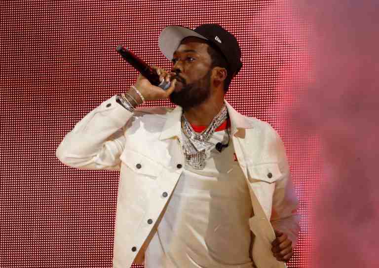 Meek Mill addresses the criticism surrounding his recent album cover art and his support for the artist behind the cover.