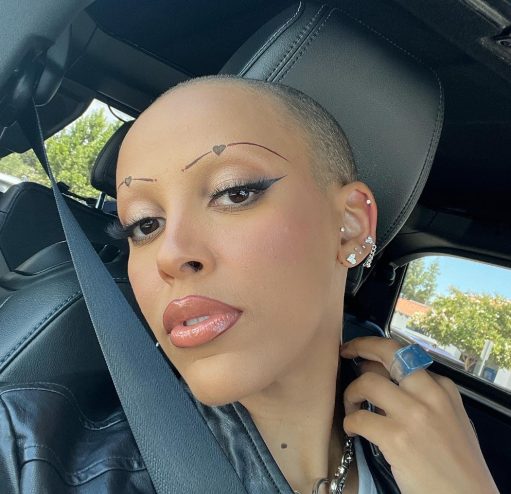 Doja Cat let's her supporters know that she is fine after shaving off her hair and eyebrows earlier this week.